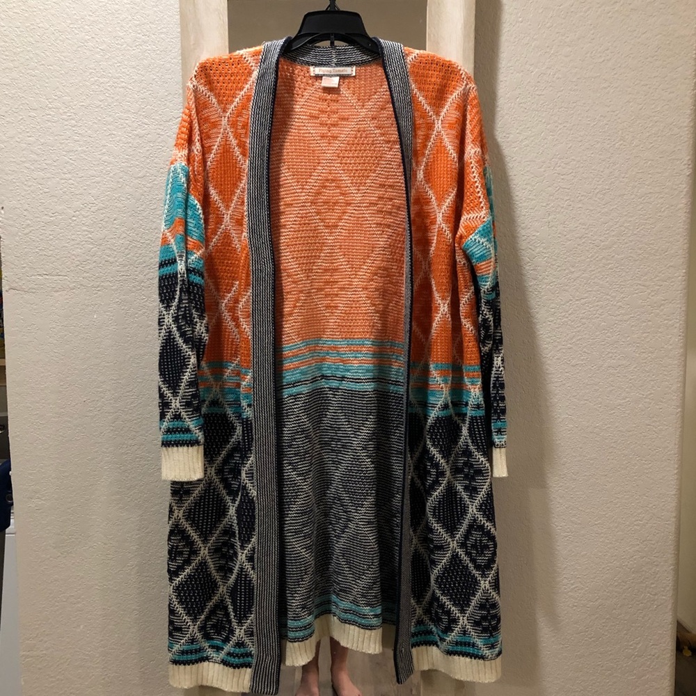 Orange and blue, flying tomato cardigan.